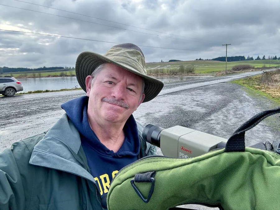 Don in the field with a spotting scope